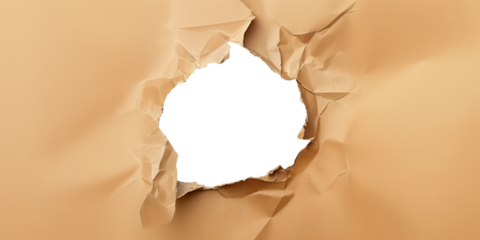 Ragged hole torn in ripped craft paper, cut out