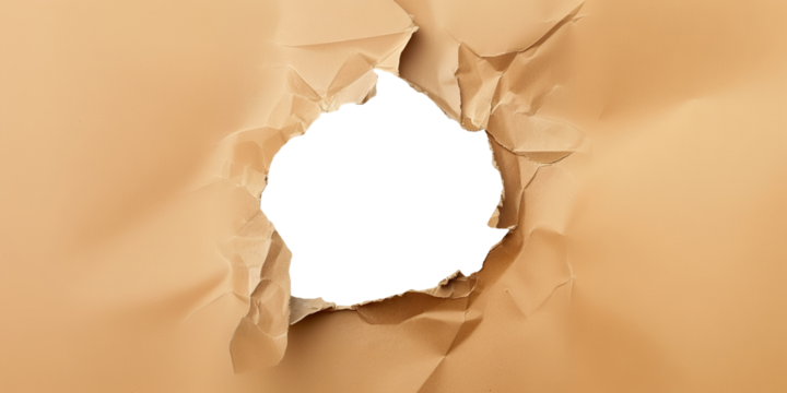 Ragged hole torn in ripped craft paper, cut out