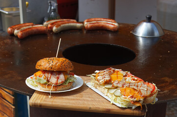 Snack stand, with fresh burger and sandwich displayed for the visitors of street food market in Karlin, district of Prague.