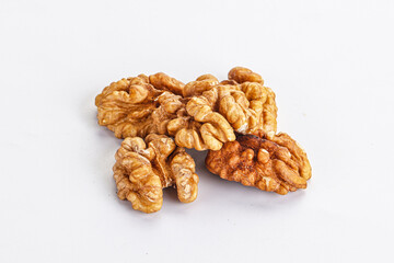 Cracked kernel walnut heap isolated