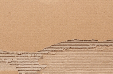 Cardboard sheet texture background, detail of recycle brown paper box pattern with torn.
