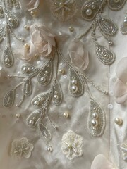 Embroidery wedding satin dress sequins, beads, pearl beads and voluminous textile flowers