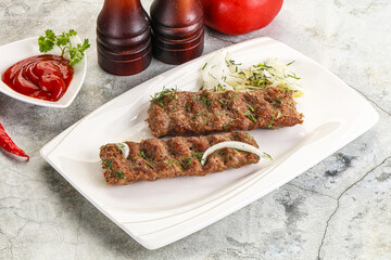 Kebab with beef served onion