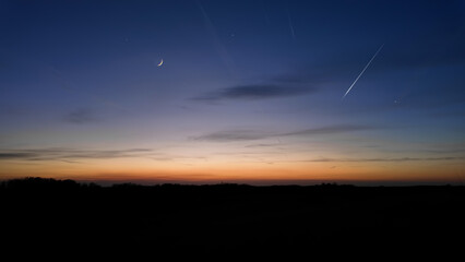  Moon, shooting star, planets, stars and landscape silhouettes. © astrosystem