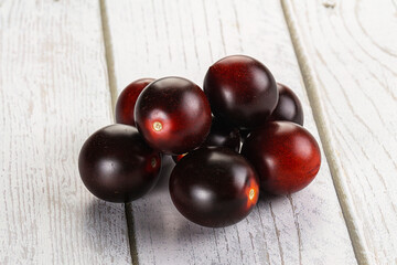 Raw ripe black kumato tomato