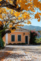 Naklejka premium A beautiful house with a yellow tree in front of it