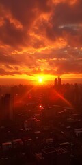 Obraz premium Fiery Sunset over the City Skyline