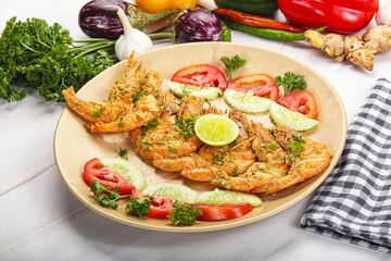 Grilled prawn served lime and vegetables