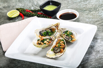 Open half oysters with green onion