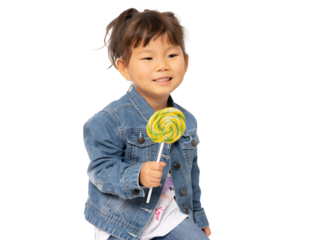 Asian little girl eating yellow lollipop candy on transparent background.