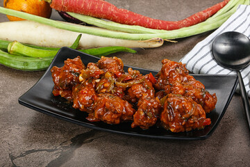 Manchurian chicken with sauce and spices