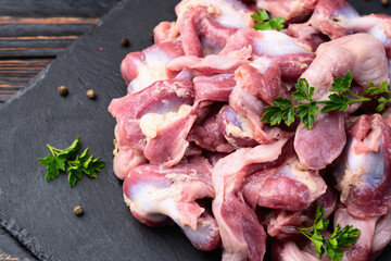 Raw chicken giblets gizzard ( stomach ) , meat background
