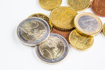 Different euro coins on white background