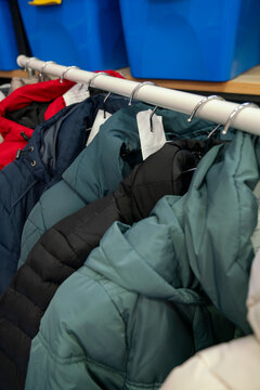 Jackets hanging on rack in laundromat