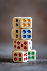 Colorful Dice Stacked Pyramid with Red, Blue, Green, Yellow, and Black Dots