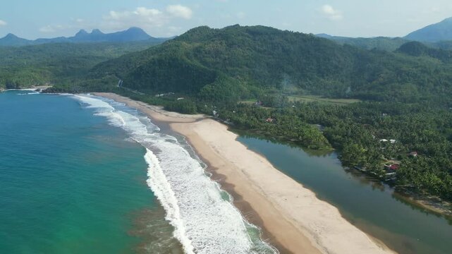 Pan Up Over Pantai Soge Beach And Mountain Ranges Java Indonesia