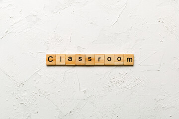 Classroom word written on wood block. Classroom text on cement table for your desing, concept