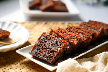 Kek Buah Kukus, a traditional Malaysian steamed fruit cake filled with dried fruits, nuts, and spices, enjoyed during celebrations.