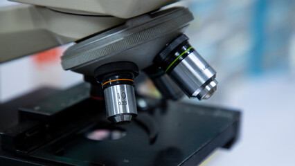 Laboratory microscope used in planning experiments, research, and examining pathogens in laboratories. Medical equipment and research samples.