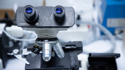 Laboratory microscope used in planning experiments, research, and examining pathogens in laboratories. Medical equipment and research samples.