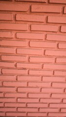 Obraz premium The wall is made of orange bricks.