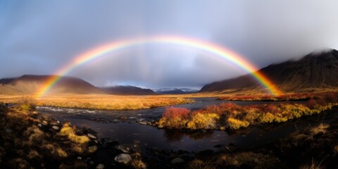 Stunning rainbow over scenic mountain landscape