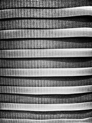 Zebra Blinds. Modern Sun Protection Curtains with Pattern and Texture Illuminated by Sun. Black and white. Monochrome.