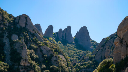 Landscape background with distinctive mountain peaks in the Montserrat massif on the Iberian...