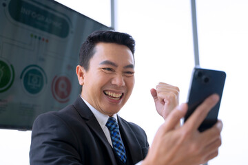 White collar worker is using smart phone at office.