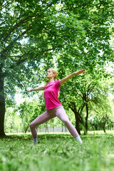 Cute European woman working out and doing yoga exercises