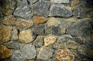 pattern gray color of modern style design decorative uneven cracked real stone wall surface with cement