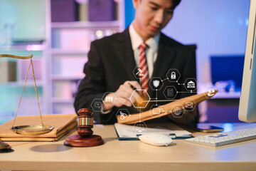 Serious pensive lawyer working overtime at desk in office.