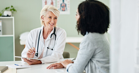 Happy woman, tablet and consulting with patient for medical results, diagnosis or prescription at hospital. Mature person or cardiologist talking to client in consultation with technology at clinic