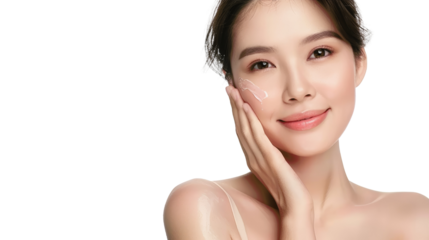 Smiling woman applying facial moisturizer,  glowing skin, beauty and skincare concept.