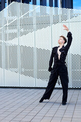 Young handsome man performing solo dance choreography