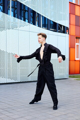 Young handsome man dancing plastically ballroom dance