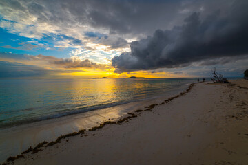 Dramatic sky over a tropical beach at sunset