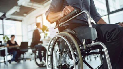 Obraz premium A man in a wheelchair is sitting in a room with a few other people