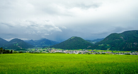 Obraz premium View of Wörgl and the surrounding mountains. Landscape in Austria. Nature in the Inn Valley in the Kufstein district in Tyrol. 