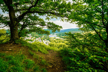 View from the Oestrich castle hill near Iserlohn. Landscape with green nature and mountains.
