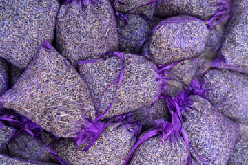 Dry lavender flowers in many bags, lavandula perfume buds, petals, fragrance lilac blossoms