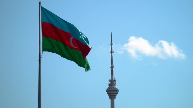 The tricolor flag of Azerbaijan flies in the center of the capital Baku