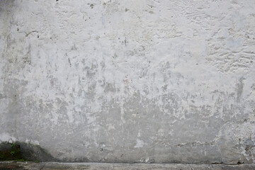 a white grunge wall background with faded white paint, typically found in abandoned or urban setting. a sense of weathered texture and urban decay, great textures for your design background.
