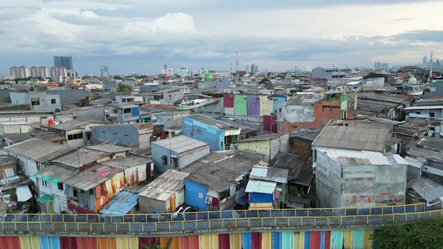Drone Rise Over Sunter Lake And Surrounding Slums In Jakarta Indonesia Cloudy Afternoon
