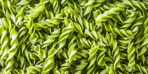 A close-up shot of a bunch of green pasta