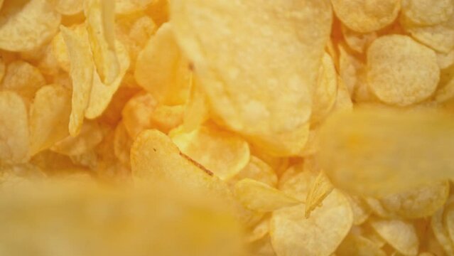 Super Slow Motion Shot of Falling Potato Chips Followed by Camera at 1000 fps.