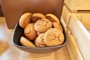 Oatmeal cookies in a dark plate on the table. The concept of proper nutrition. Self-service restaurant