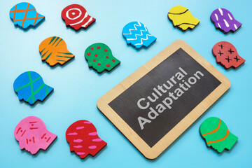 Colorful heads and cultural adaptation sign.