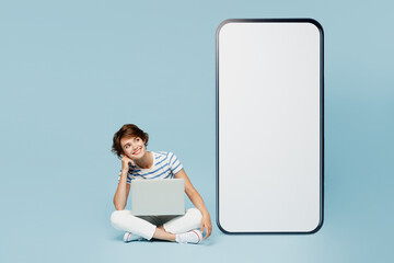 Full body young smart IT woman wears striped t-shirt casual clothes big huge blank screen mobile...
