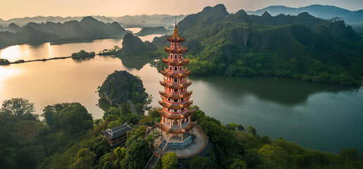 Obraz premium Very tall Thai temple in a wide natural panorama. Huge sacred pagoda. Buddhism, zen, peace, tranquility, spirituality.